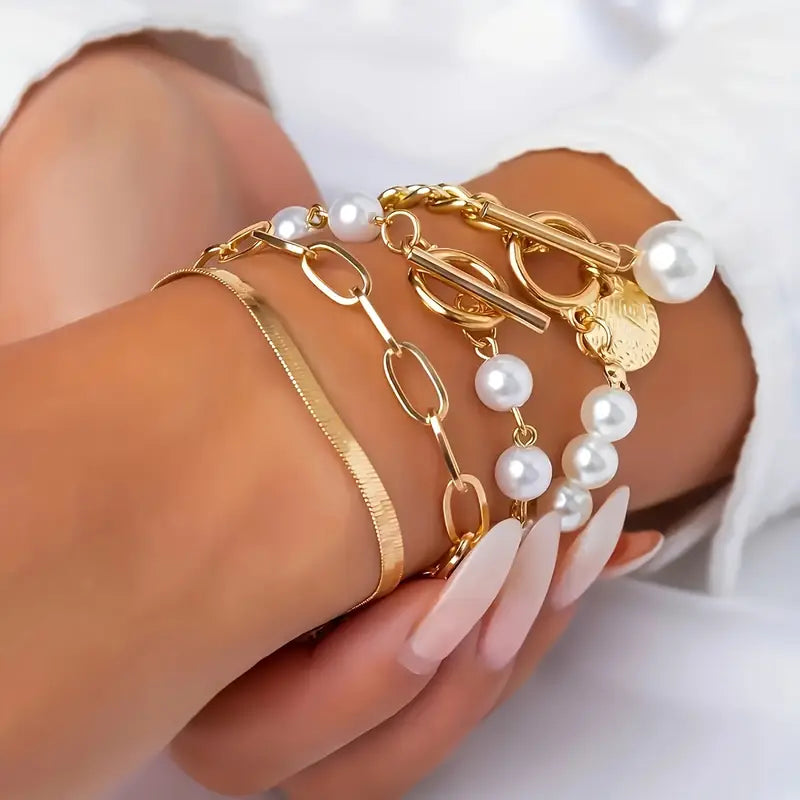 Elegante conjunto de 4 pulseras doradas: serpiente, perlas y eslabones | Oro