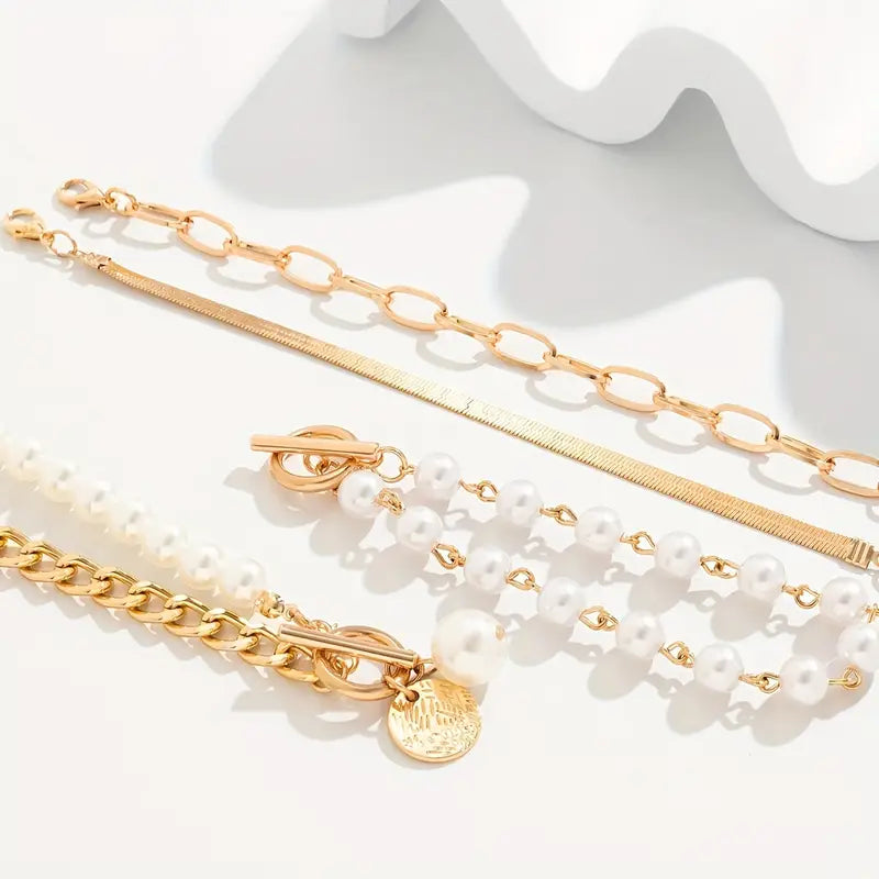 Elegante conjunto de 4 pulseras doradas: serpiente, perlas y eslabones | Oro