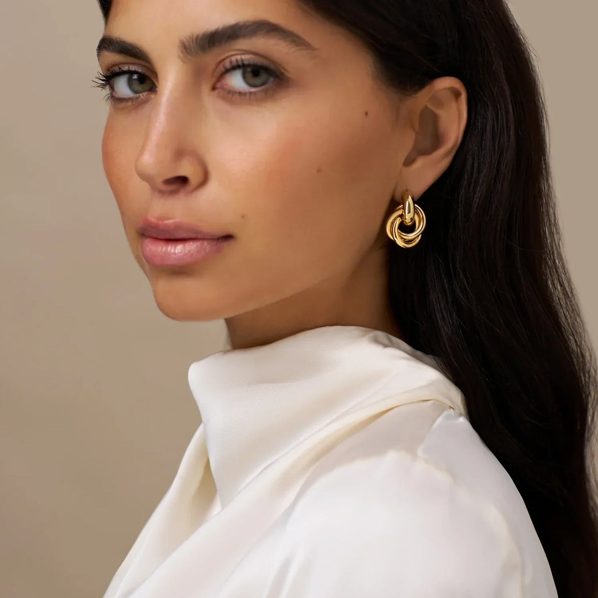 Aretes entrelazados llamativos | Oro