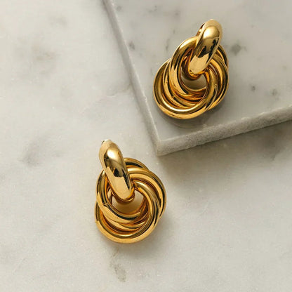 Aretes entrelazados llamativos | Oro